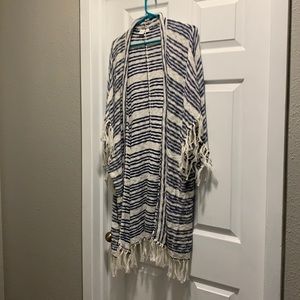 Oversized fringe poncho